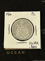 Reverse side showing Canadian coat of arms, date 1966, and silver content marking.