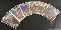 Six Star Wars comics fanned out showing cover art and titles including Poe Dameron and Solo series.