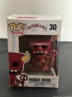 Front view of boxed Funko Pop! Robot Devil figure showing packaging and figure inside.