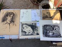Layout of six sketches on a table featuring portraits, figures, interiors, and still life drawings in charcoal and pencil.