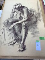 Seated nude figure rendered in charcoal on large sheet with green label 40L×26W