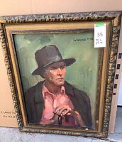 Framed oil painting of a man wearing a hat and pink shirt, holding a cane, signed LeGrande 1976.