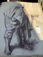 Full view of large charcoal sketch of barefoot man with hat pointing, shows tear and aged paper