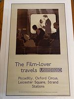 Photo showing the full poster mounted in white matting with the film audience viewing a romantic scene, including text as described.