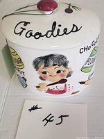 Front and side view showing the jar's hand-painted smiling girl and ingredient labels
