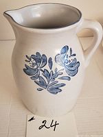 Side view of Pfaltzgraff stoneware pitcher showing blue floral Yorktowne pattern and handle