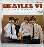 Front cover image of Beatles VI vinyl album showing the band members and album title.