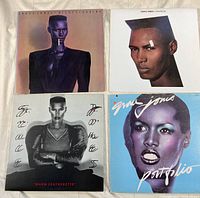 Top view of four Grace Jones vinyl record covers - Nightclubbing, Living My Life, Warm Leatherette, Portfolio