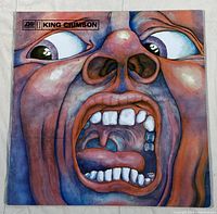 Front cover of King Crimson album showing distinctive colorful face artwork.