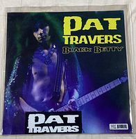 Front of vinyl record sleeve showing Pat Travers playing guitar, the title Black Betty and Pat Travers name.