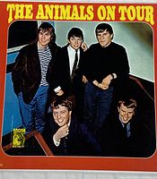 Front cover of The Animals On Tour vinyl record album with band photo and title.