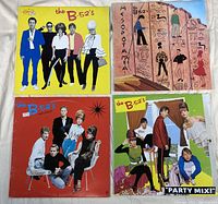 Four vinyl record album covers by The B-52's showing distinctive colorful artwork and band member images.