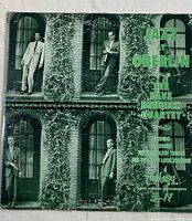 Front cover of the 'Jazz at Oberlin' vinyl record album by The Dave Brubeck Quartet, showing a black and white group photo and green print text with track listing.
