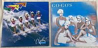 Front covers of The Go-Go's Vacation and Beauty and the Beat vinyl records showing the distinct album artwork on each cover.
