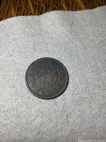 Top side of the 1859 Canada large one cent coin showing 'ONE CENT 1859' text and decorative border.
