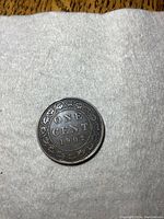 Reverse side showing denomination ONE CENT and year 1902 with wreath border.