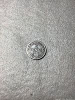 Front side of 1912 Newfoundland 5 cent coin with denomination and date