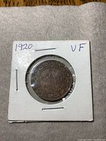 Obverse and reverse views of the 1920 Canada one cent coin in wearable condition.