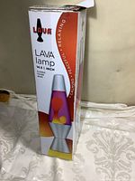 Lava lamp in original box showing product graphics and size (14.5 inches tall)