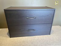 Front view of a 2-drawer stackable organizer cabinet with espresso finish, showing both drawer fronts with metal handles.