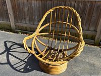 Angle showing circular base and twisted bentwood frame of papasan egg chair frame