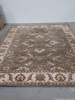 Front view of the handwoven wool rug showing full pattern and border detail.