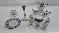 Full set of Lenox Belleek Laurel Wreath silver overlay china with additional vintage silver overlay glass items displayed together.