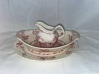 Three-piece Mason's Ironstone set including pitcher and two oval dishes with red transferware pattern