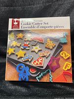 Front of the box showing colorful cookie cutters and decorated cookies on a tray