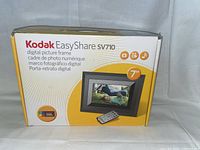 Box of Kodak EasyShare SV710 digital picture frame, showing brand and model details on side of box.