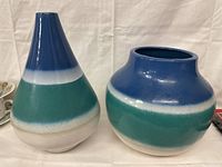 Two ceramic vases placed side by side showing their shapes and color patterns.