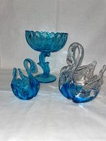 Photo showing all three pieces: lotus bowl and two swan trinket bowls