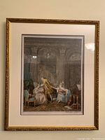 Full view of framed coloured etching showing period interior scene with three figures and musical elements.