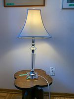 Full view of the table lamp showing overall design, shade, and cord
