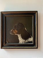 Front view of oil painting showing dog portrait and frame
