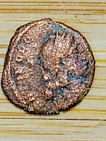 Obverse of coin showing worn portrait of Emperor Theodosius I in profile