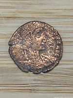 Obverse side of ancient roman bronze coin showing profile bust of Emperor Constantius II