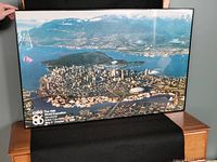 Framed aerial view poster of Vancouver Expo 86 showing the cityscape and water with event details in white text on bottom left.