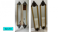 Two skinny long rectangular mirrors with ornate gold-colored frames, each with decorative leaf and scroll designs at the top and bottom. One mirror has a barely visible hairline crack. Dimensions approximately 8.5 inches wide by 49 inches high.