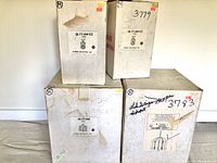 Five original boxes with labels showing model numbers for ceiling light fixtures