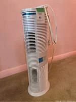 Side view of white TherpaPure air purifier tower showing vents and power cord.