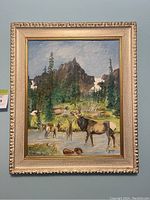 Front view of the framed elk painting showing elk by a stream with mountains and trees in background.