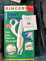 Close-up of Singer Cordless Smart Scissors box showing the product, features, and included replacement blades.