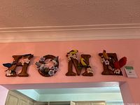 Full assembled “HOME” sign mounted above doorway