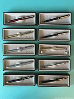 Ten Quill brand salesman sample pens in original fitted boxes.