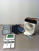 Wireless thermometer set with display and three remote sensors, 4 solar LED lights, and the cooling/mist fan.