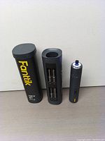 Fanttik S1 Pro electric screwdriver with metal case showing screwdriver and bit holder with steel bits