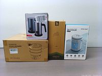Full view of boxed items: Food steamer, milk frother, vacuum bottle box, air cooler box