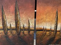 Close-up photo showing textured abstract tree shapes on canvas, in earth tone colors.