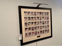 Framed collage of 45 NHL All-Star hockey cards arranged in rows inside a large black frame with cream matting.